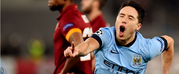 Samir Nasri wheel away to celebrate after opening the scoring with a screamer against Roma on Wednesday night