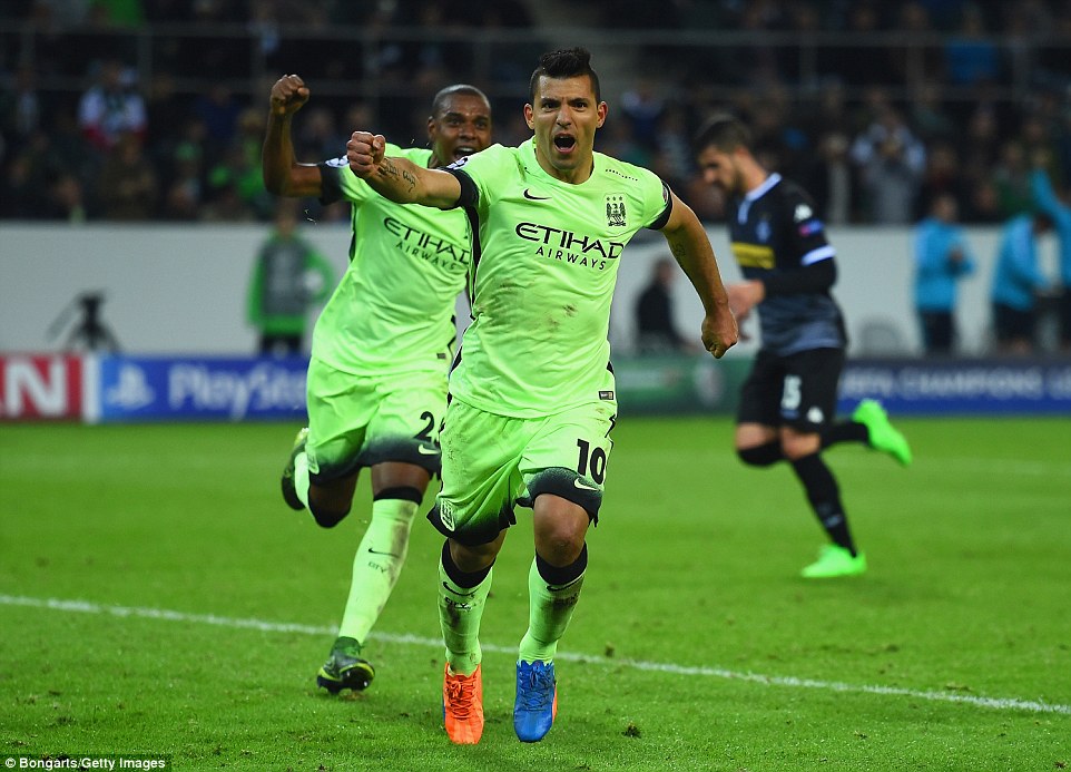 Sergio Aguero wheels away to celebrate after slotting home a late penalty that gave City victory over Borussia Monchengladbach