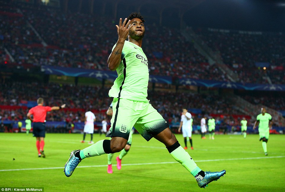 Raheem Sterling celebrates after opening the scoring by coolly slotting the ball past the opposition 'keeper